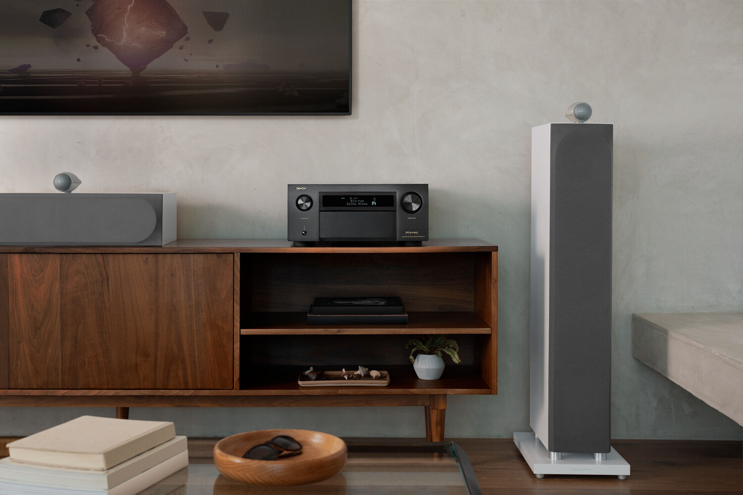 A-Series AVR sitting on a tv stand with LCR speakers